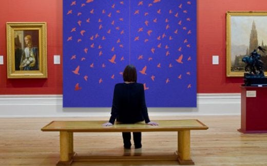 Laser Felt Eco, Flying Birds, Cobalt color wall panels in the art gallery.